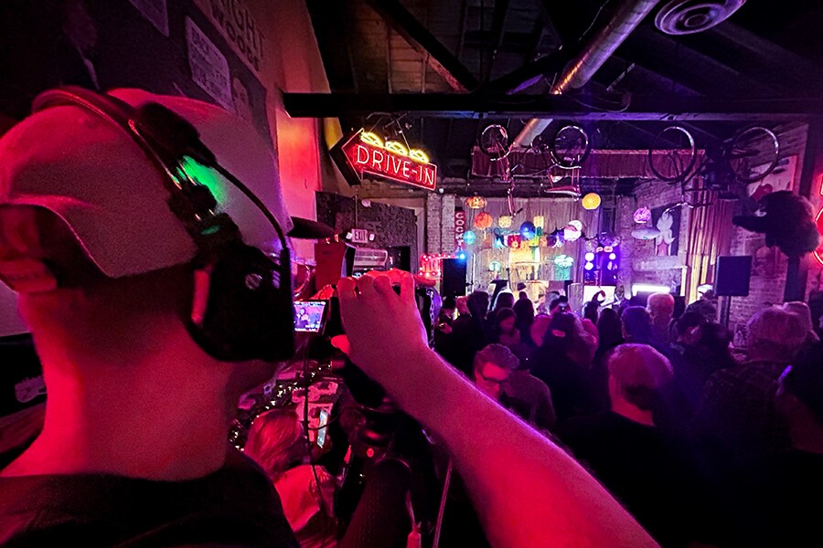 Cameraman filming a live performance at Daddy Diamonds for MTV's "The Underground."